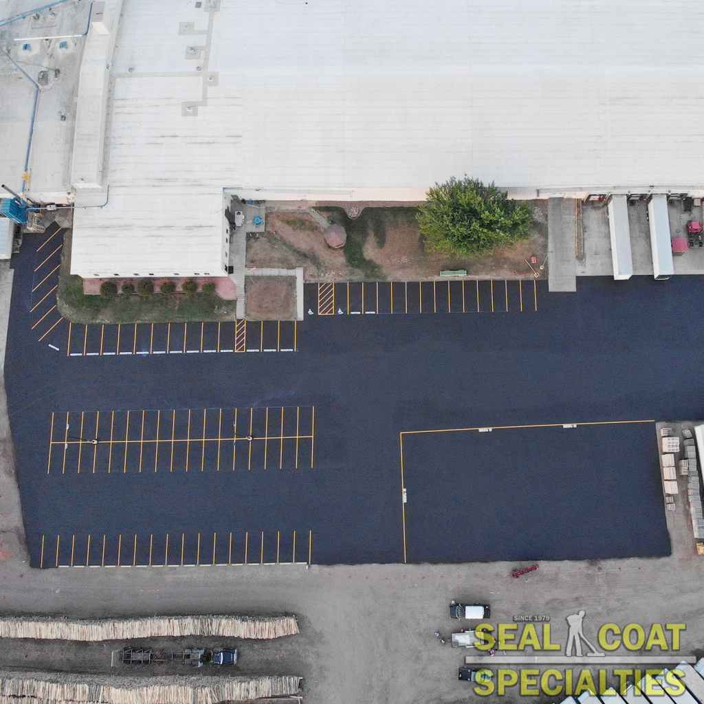 Overview of a parking lot that was crack filled, sealcoated, and line striped in Rice Lake