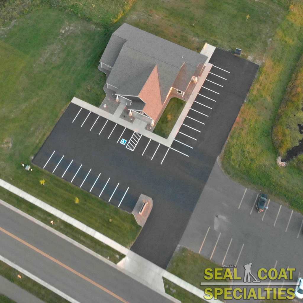 Rice Lakes most preferred sealcoating company finished looked at a parking lot